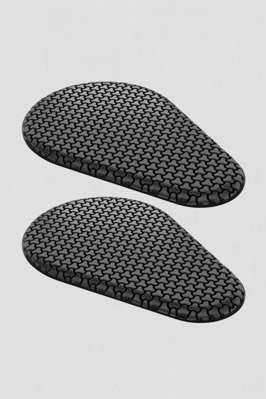 Two black armor inserts on a light gray background