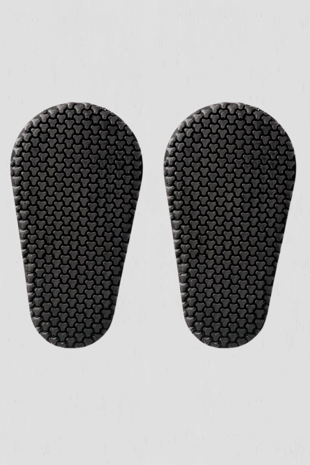 Pair of black armor inserts on a light gray background