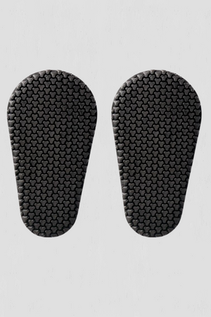 Pair of black armor inserts on a light gray background