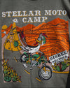 Gray t-shirt with 'Stellar Moto Camp' graphic design featuring a cartoon character on a motorcycle.
